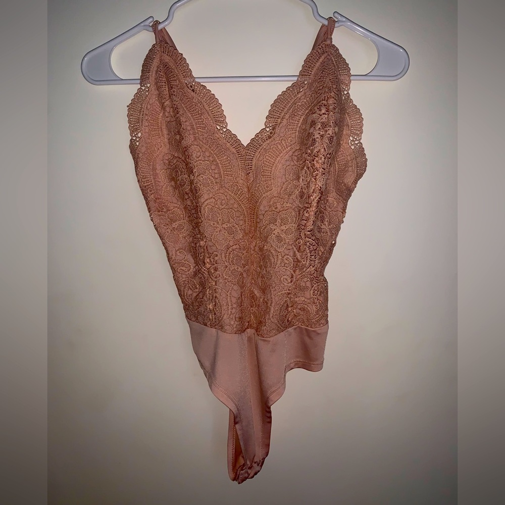 Pink lace body suit